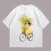 A girl riding a bicycle with flowers